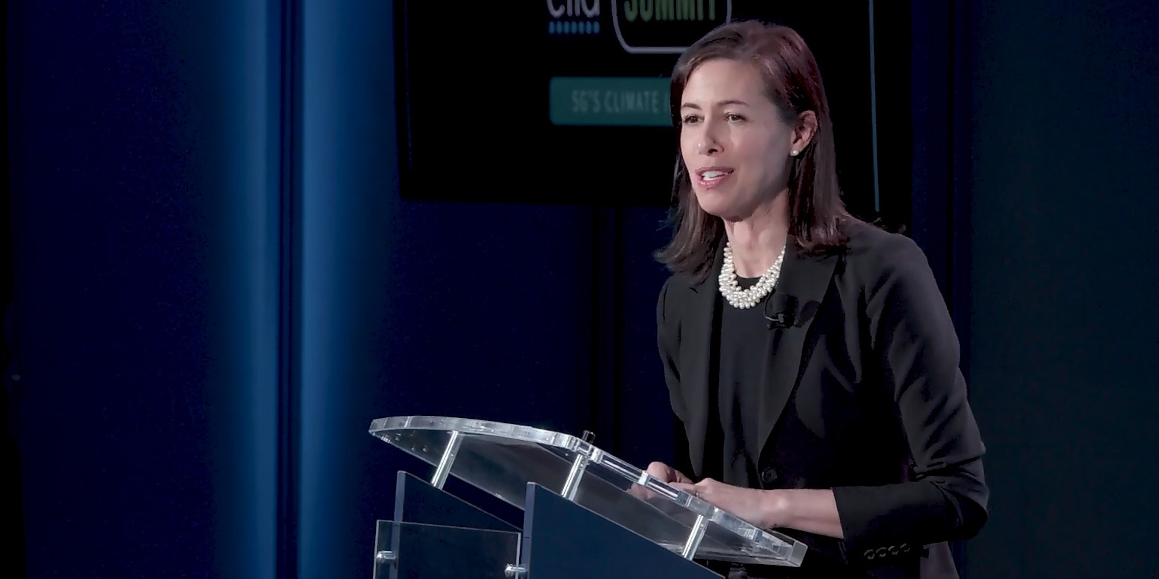 Jessica Rosenworcel standing a podium.